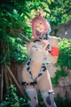 A woman in a cow costume posing for a picture.