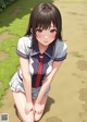 A girl in a school uniform sitting on the ground.