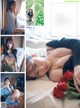 A woman laying on a bed holding a bunch of red roses.